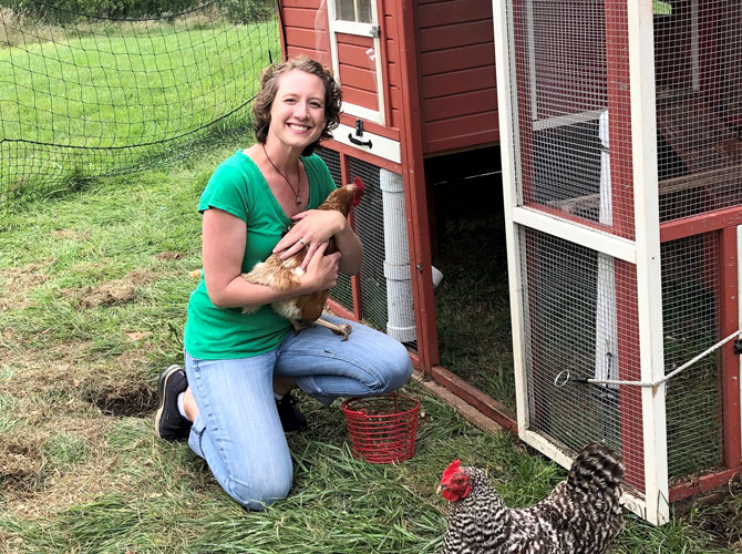 Jenna Bjork holding a chicken